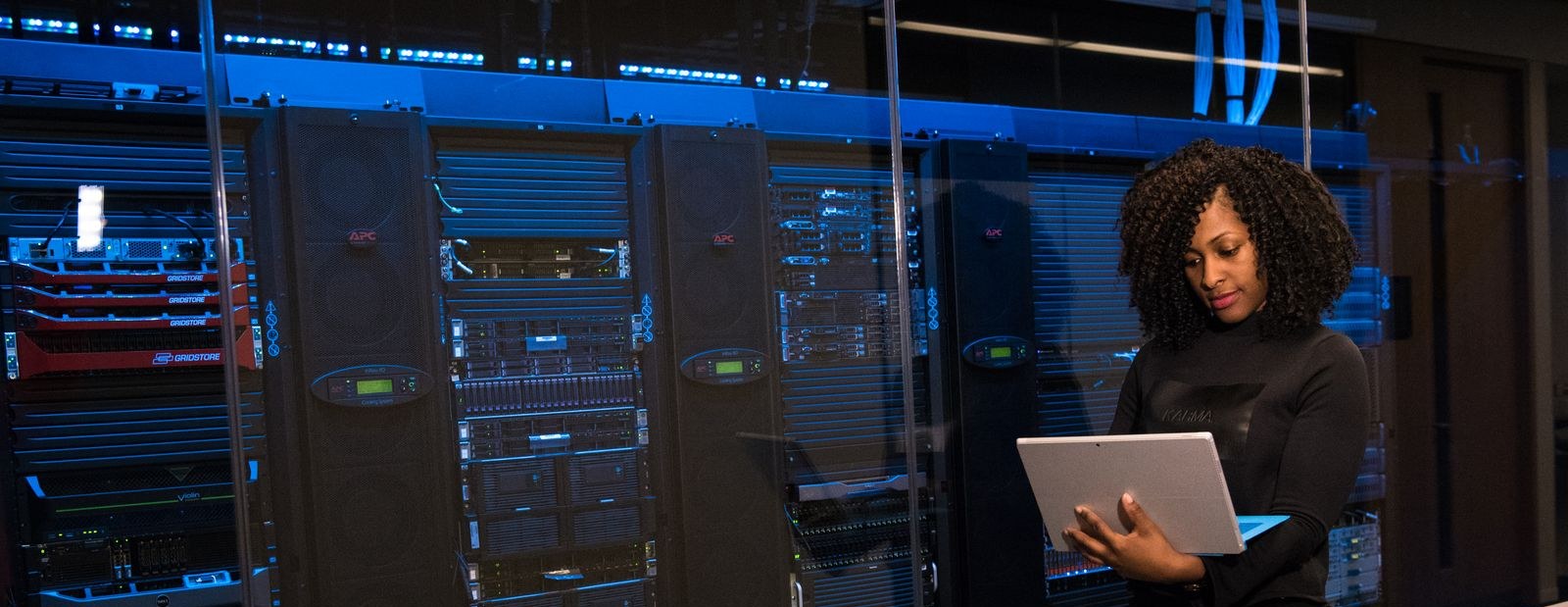 IT professional reviewing server infrastructure in a data center
